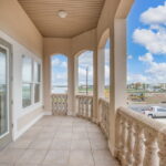 2nd Floor Covered Patio off Owner's Suite. Beautiful Water Views.