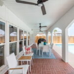 Spacious covered patio. Tiled flooring. Plenty of room to entertain here!!