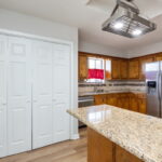 Walk into the kitchen where the laundry closet is also located.