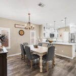 Dining area with Plantation Shutters, gorgeous kitchen and easy care flooring.