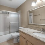 Hall bath area. Tub/shower combo. Granite counters.