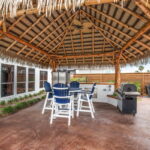 Palapa area - beautifully surrounded by landscaping, outdoor kitchen and water views!