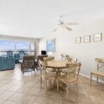 Open Dining & Living Area with Beautiful Beach Views! New Dining Room Table and 6 Chairs 2023 (My Coastal Home Furniture Store).