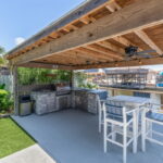 Covered patio/BBQ area overlooking the water canal & pool. Perfect for entertaining!