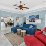 Living area with door out to the upper deck off the living/primary bedroom.