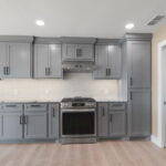 Next to the kitchen is the laundry room with brand NEW stackable washer/dryer.