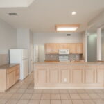 Kitchen with plenty of room for extra cooks. Pantry. Breakfast bar. Door into laundry area.