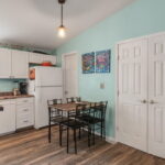 Seating area with the pantry in the corner. The double doors open to the Primary Bedroom.