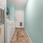 Laundry room with access door to the back patio.