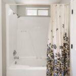 Jetted tub with own shower in the owner's bath.