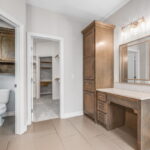 Vanity in primary, private commode, and HUGE closet with OFFICE!