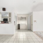 Wet bar and on the right is the door to the laundry.