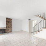 Sizeable family room with wood burning fireplace.