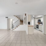 Kitchen, right of the kitchen are doors to the wet bar.