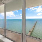 WATERFRONT view from Primary Bedroom. NOTE the fishing pier below!