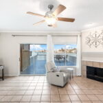 Living room opens up to expansive deck and dock.