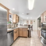 Stainless steel appliances & tile countertops