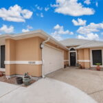 Low maintenance front yard with side entry garage.