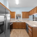 Kitchen has windows that offer a water view.