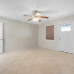 Spacious Primary Bedroom with tile floors.