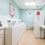 Community first floor coin-operated laundry area.