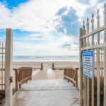 Open the gate to the board walk and out to the beach and Gulf waters.