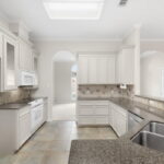 Kitchen with plenty of storage, pantry and beautiful granite. Looking back towards Formal Dining.