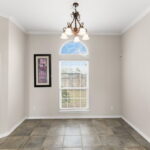 Breakfast area next to the living and kitchen with door out to the screened patio area.