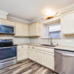 Stainless-steel appliances located in the kitchen.