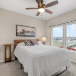 Guest bedroom with water view.