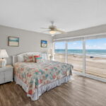 Front bedroom with wood look tile flooring.
