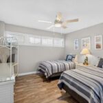 2nd bedroom with wood look tile flooring.