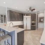 Stylish gourmet kitchen. Cambria quartz counter tops, backsplash, upgraded appliances.