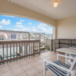Outdoor from the living/dining is the covered patio with steps to the upper decking.