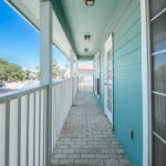 Upstairs - Covered front of home patio deck. Access from bedroom # 2 and #3