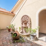 Courtyard offering a fountain and access to another bedroom & bath