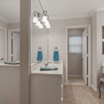 Two vanities and two toilets back-to-back