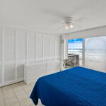 1st guest bedroom with closed sliding doors for privacy.