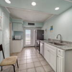 Kitchen area with granite counters.