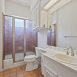 Hall bathroom in between two bedrooms
