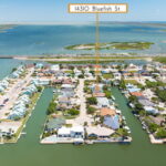 Aerial view of Laguna Madre and roadway coming on/off Padre Island in the distance.