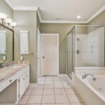Primary bath area. Soaking jetted tub. Separate Shower and doorway to walk-in closet.