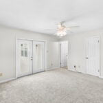 Primary Bedroom with access to the back deck/pool.