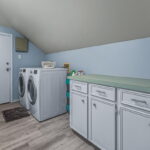 Second floor utility room has plenty of extra storage space.