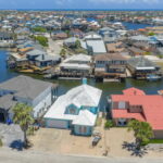 Plenty of parking in front for cars and boat trailers. Even has a basketball area!