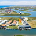Aerial View of the 4-building sites, Lake Padre and the Gulf of Mexico. Walking distance away.