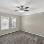 Primary bedroom looks into the back yard.