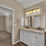 Primary bathroom with dual sinks.