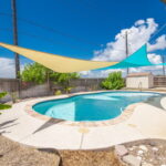 Sparkling in-ground concrete pool.