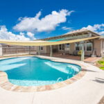 oversized back yard with pool, patio and plenty of room for all the toys!